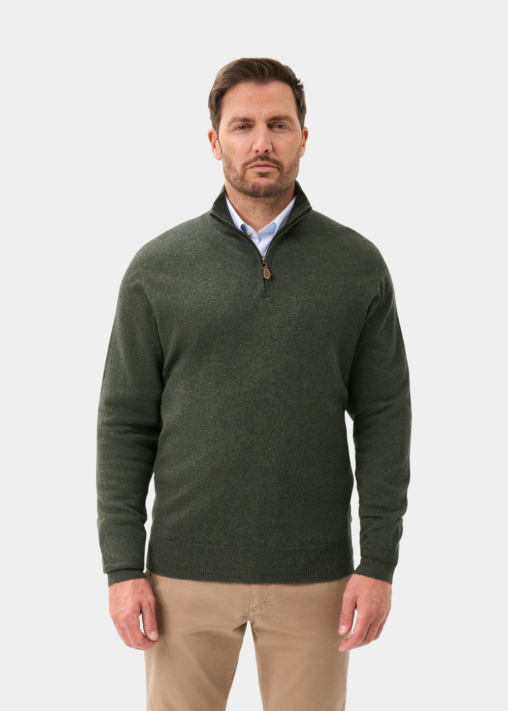 Man in Hanbury Pure Cashmere Quarter Zip Jumper in Rosemary and khaki pants stands facing forward on white background.