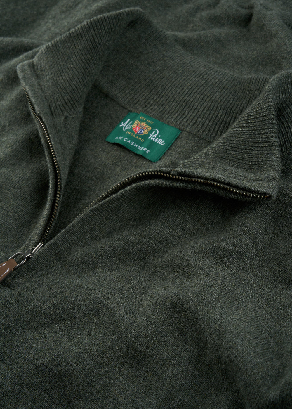 Close-up of a rosemary Hanbury Pure Cashmere Quarter Zip Jumper, regular fit, with label near the collar.