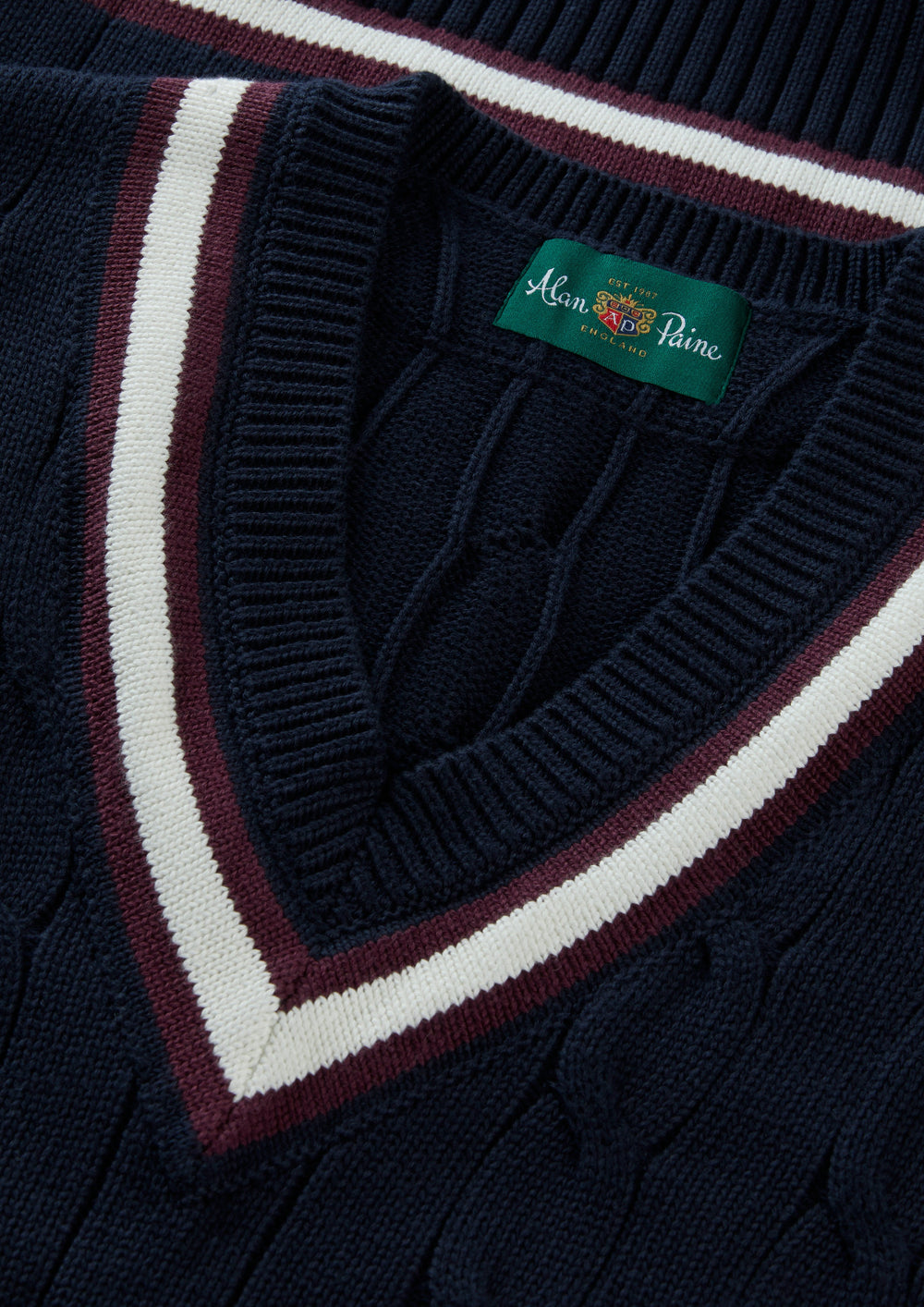 Chadbury cotton cable knit V-neck slipover in dark navy/blackcurrant with striped collar, regular fit, Alan Paine label.