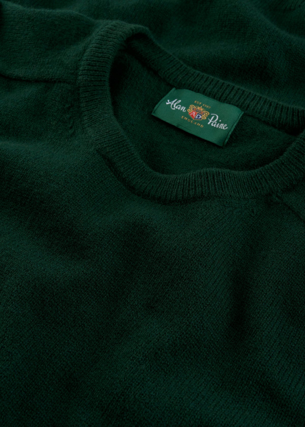 Dorset Lambswool Crew Neck Jumper in Tartan Green, classic fit, with Alan Paine label visible on the collar.