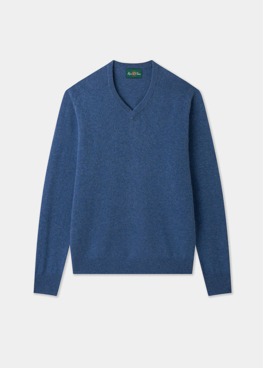 Hampshire Lambswool Vee Neck Jumper in Jeans, classic fit, with ribbed cuffs and hem, laid flat on white background.
