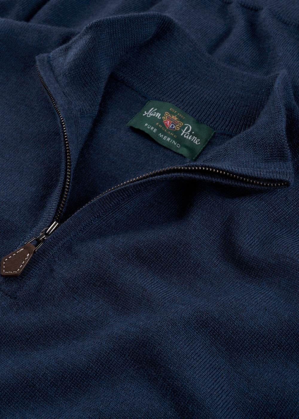 Barton Merino Wool Quarter Zip Jumper in indigo with leather zipper pull and green Alan Paine label, regular fit.