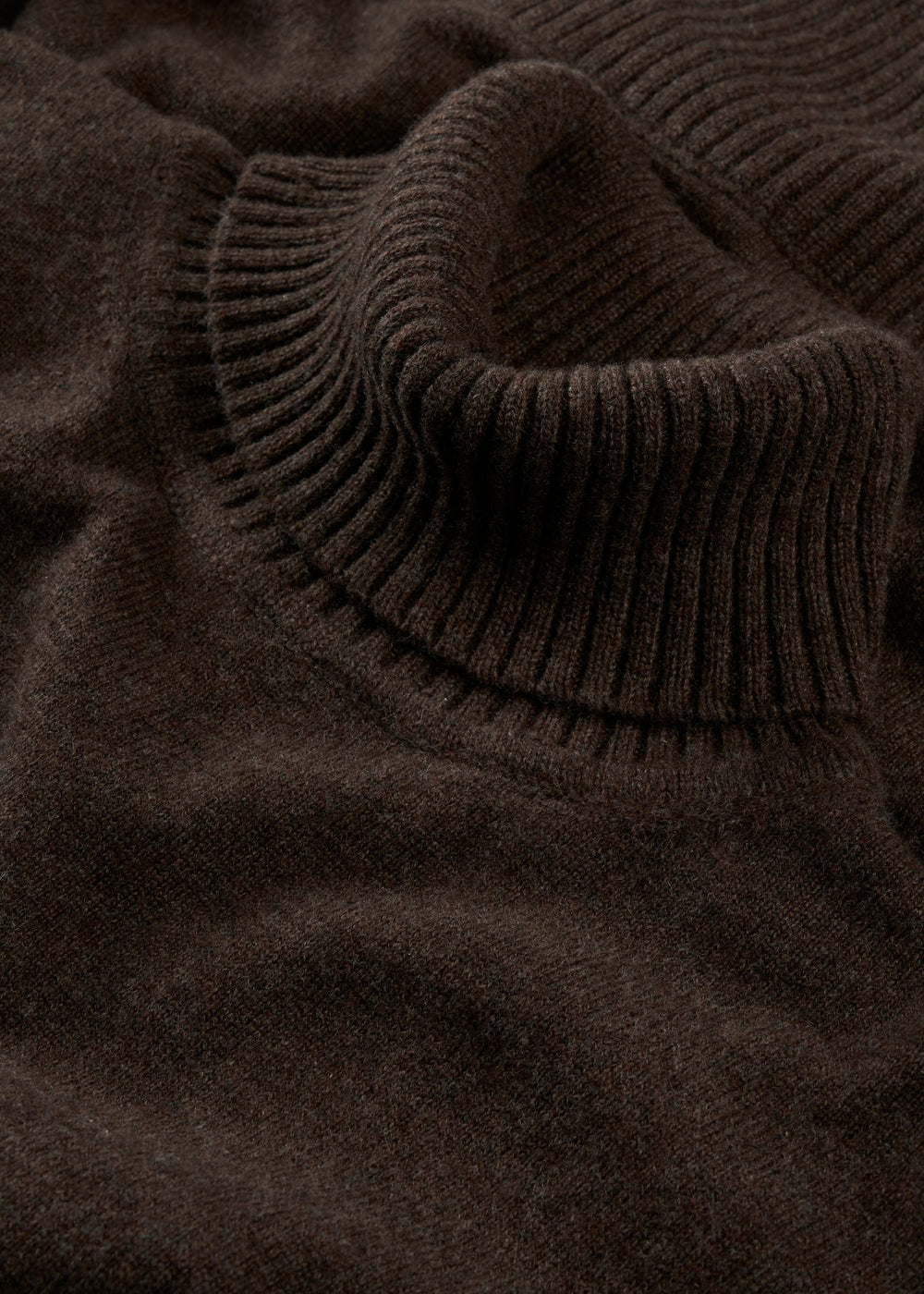Close-up of the Alexa Wool & Cashmere Roll Neck Jumper in walnut, showing its soft texture and ribbed knit detail.