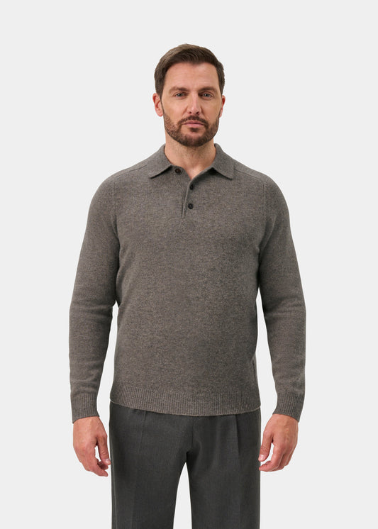 Man in a Bilsdean Men’s Lambswool Long Sleeve Polo in Vole, regular fit, with dark pants, against white backdrop.