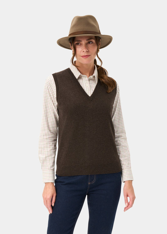 Woman wears the Erin Wool & Cashmere V-Neck Slipover in Walnut over a plaid shirt, with hat and dark jeans.