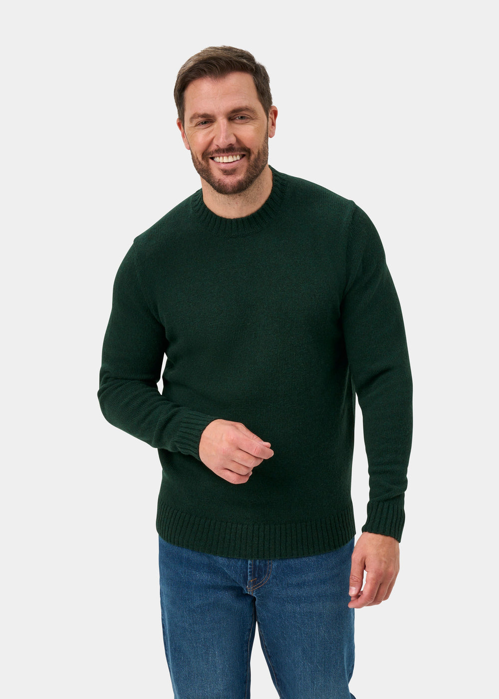 Man in Kinnadie Supersoft Shetland Wool Crew Neck Jumper in Cossack, regular fit, and blue jeans on white background.